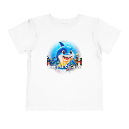 White kids birth month tshirt with March design featuring a blue shark and energetic fearless text