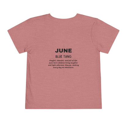 Kids birth month tshirt in pink with June Blue Tang design and descriptive text on the back