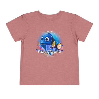Kids birth month tshirt featuring a playful blue tang fish graphic on a dusty pink kids shirt