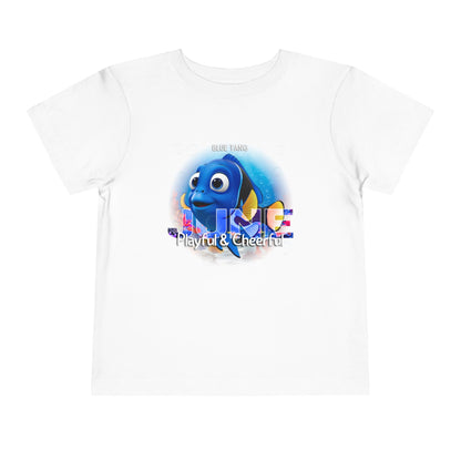 White kids birth month tshirt featuring playful blue tang fish graphic with playful and cheerful text