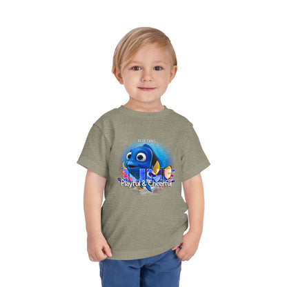 Toddler wearing kids birth month tshirt with blue tang fish graphic and playful cheerful text