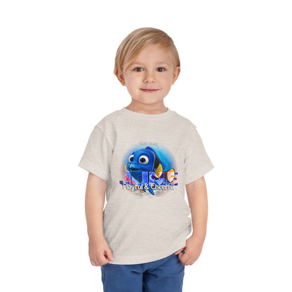 Toddler wearing a kids birth month tshirt featuring a playful blue fish graphic 