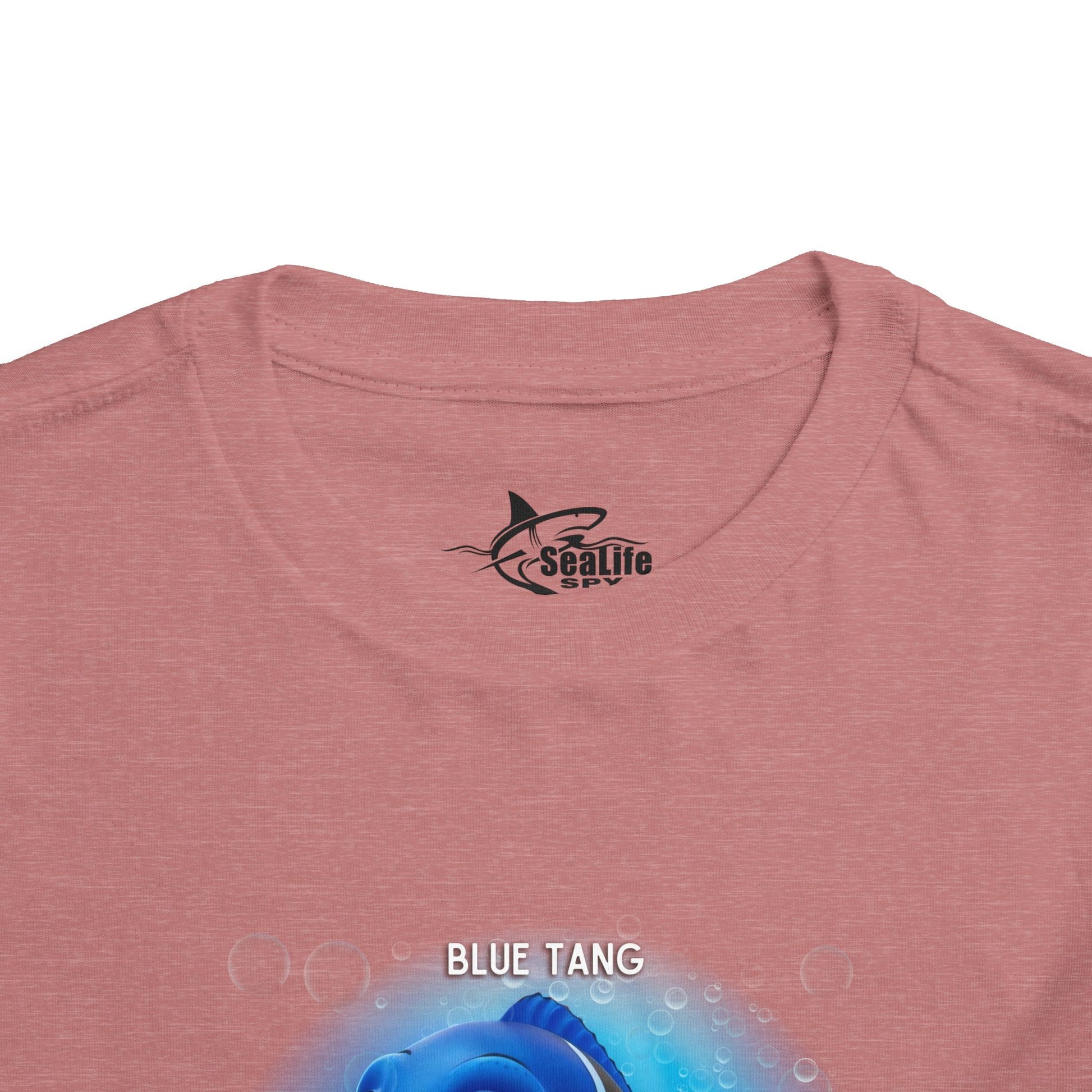 Kids birth month tshirt featuring a Blue Tang fish design on a pink shirt