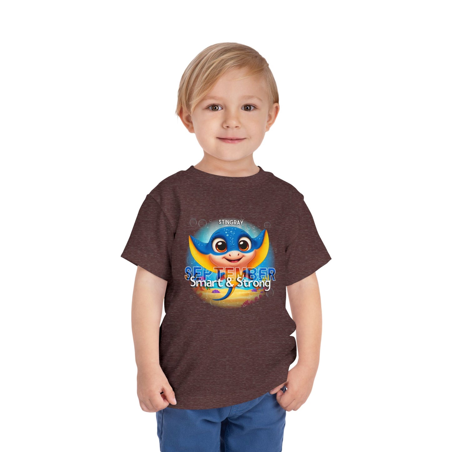 Toddler wearing a September kids birth month tshirt with colorful stingray graphic