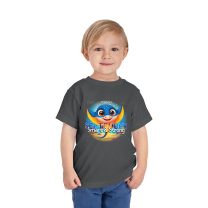 Young boy wearing kids birth month tshirt with September stingray design and smart strong text