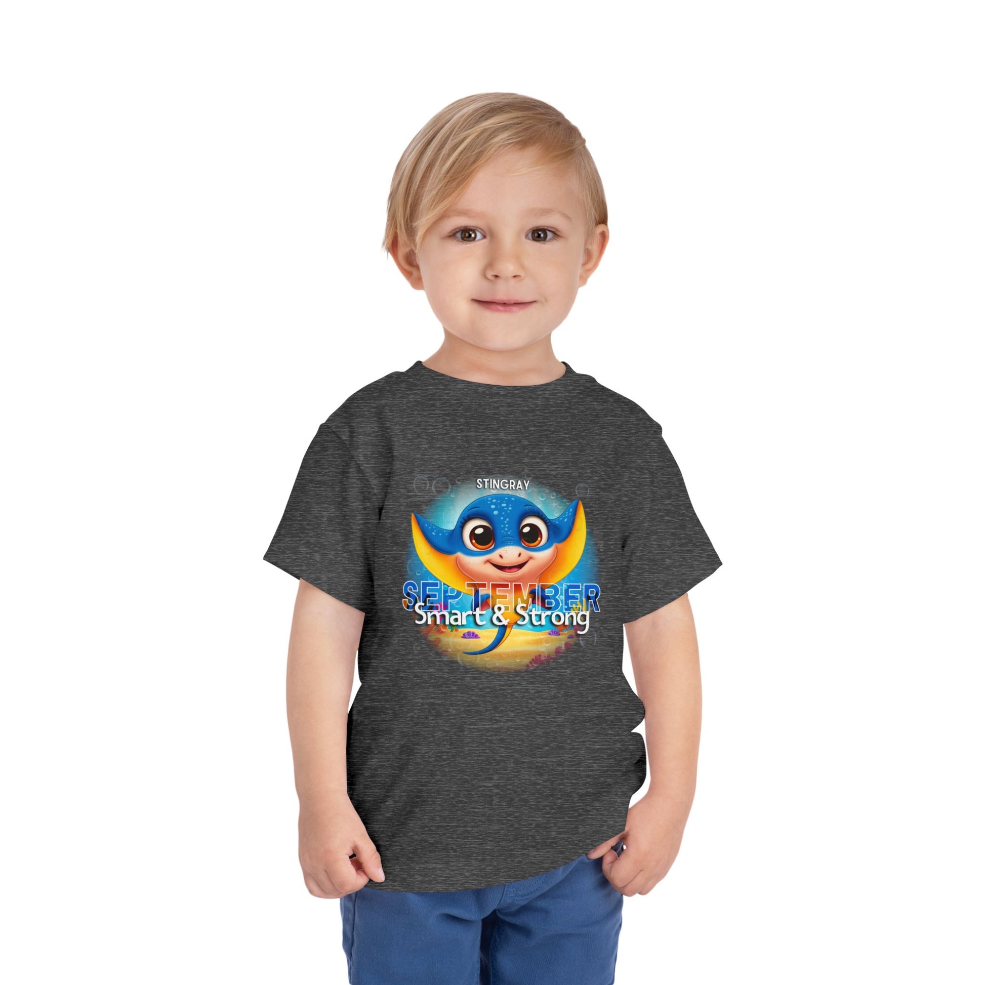 Kids birth month tshirt with colorful stingray design for September, worn by young boy