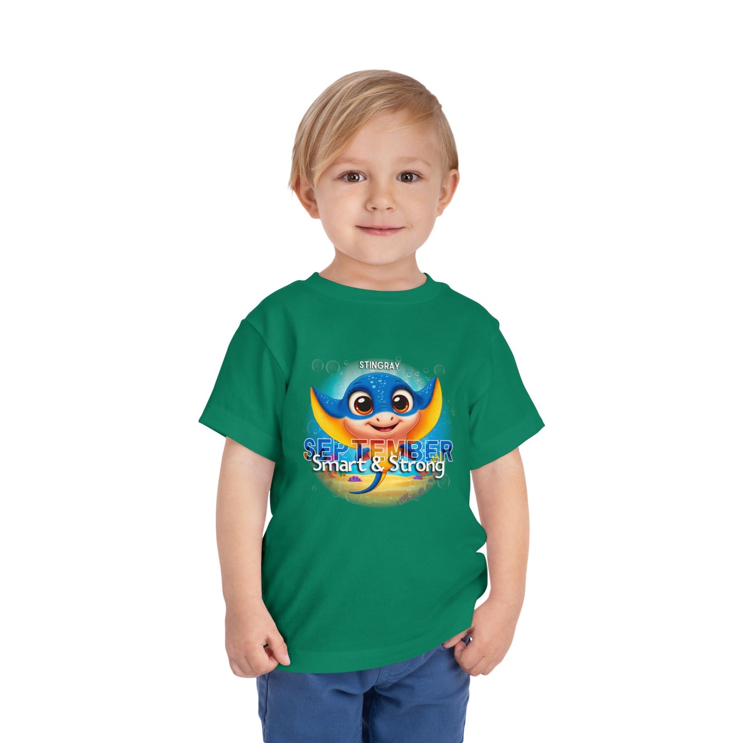 Toddler wearing green kids birth month tshirt with September stingray design 