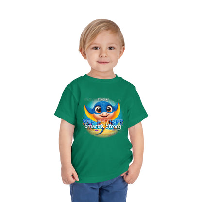 Toddler wearing green kids birth month tshirt with September stingray design 