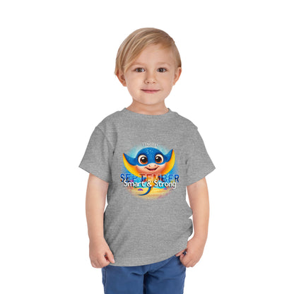 Toddler wearing a gray kids birth month tshirt with a colorful stingray and September text