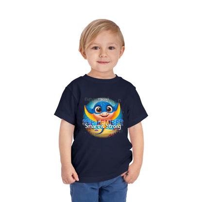 Toddler wearing a navy kids birth month tshirt with a colorful September stingray design