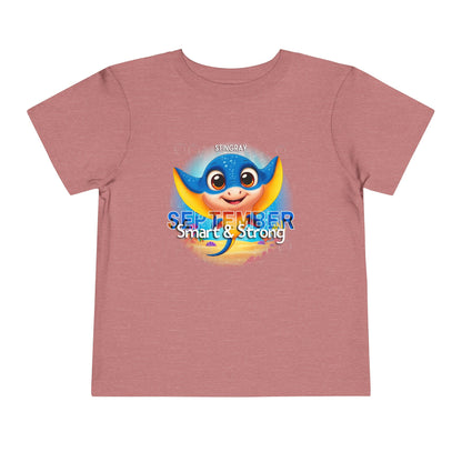 Kids birth month tshirt featuring a cute stingray and September text on pink short sleeve shirt