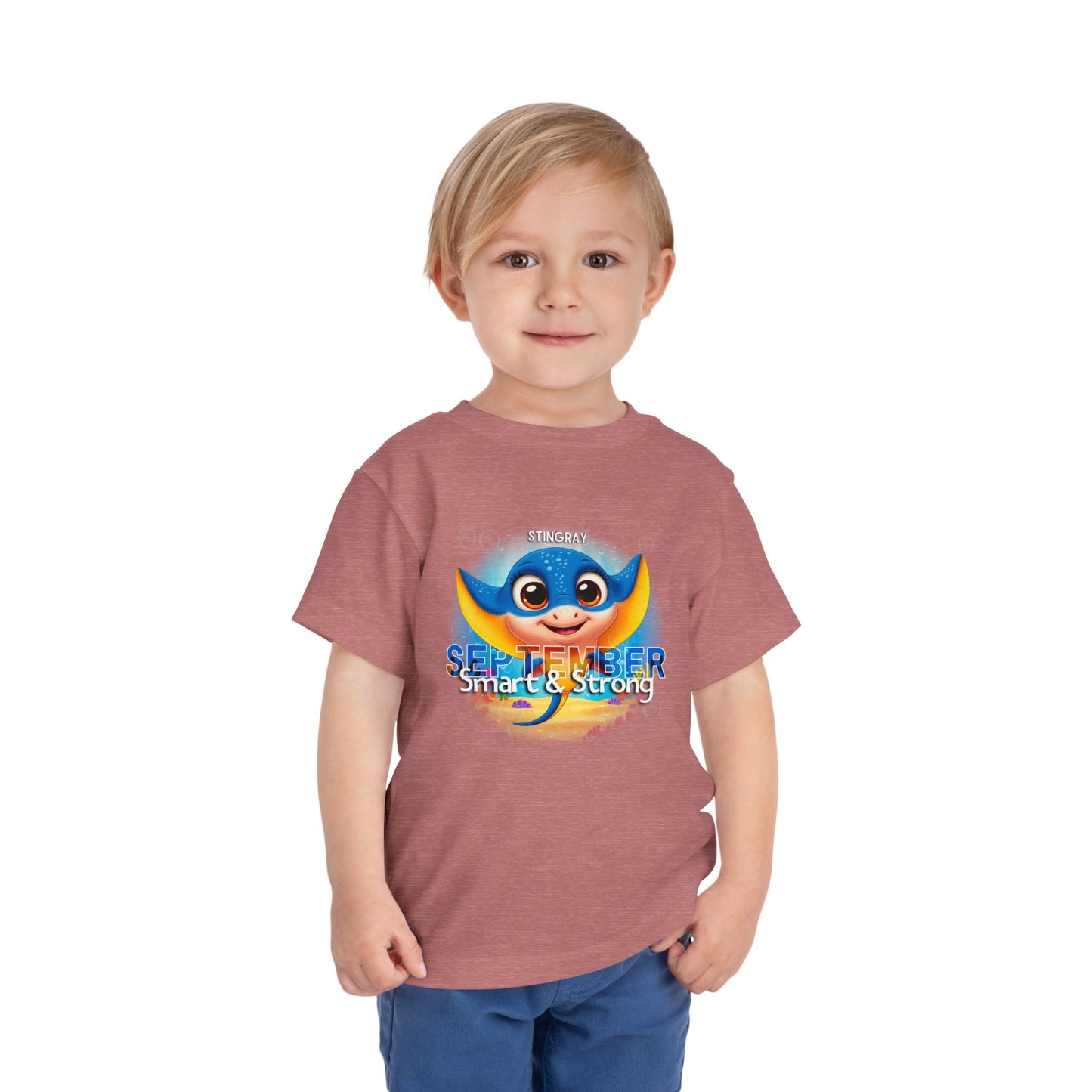 Toddler wearing a kids birth month tshirt with a colorful stingray and September text