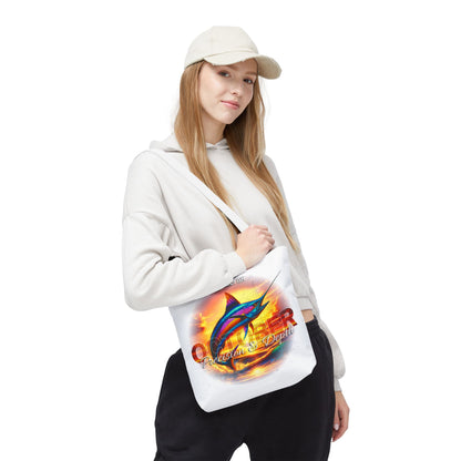 Woman wearing a white birth month beach tote with colorful marlin fish design 
