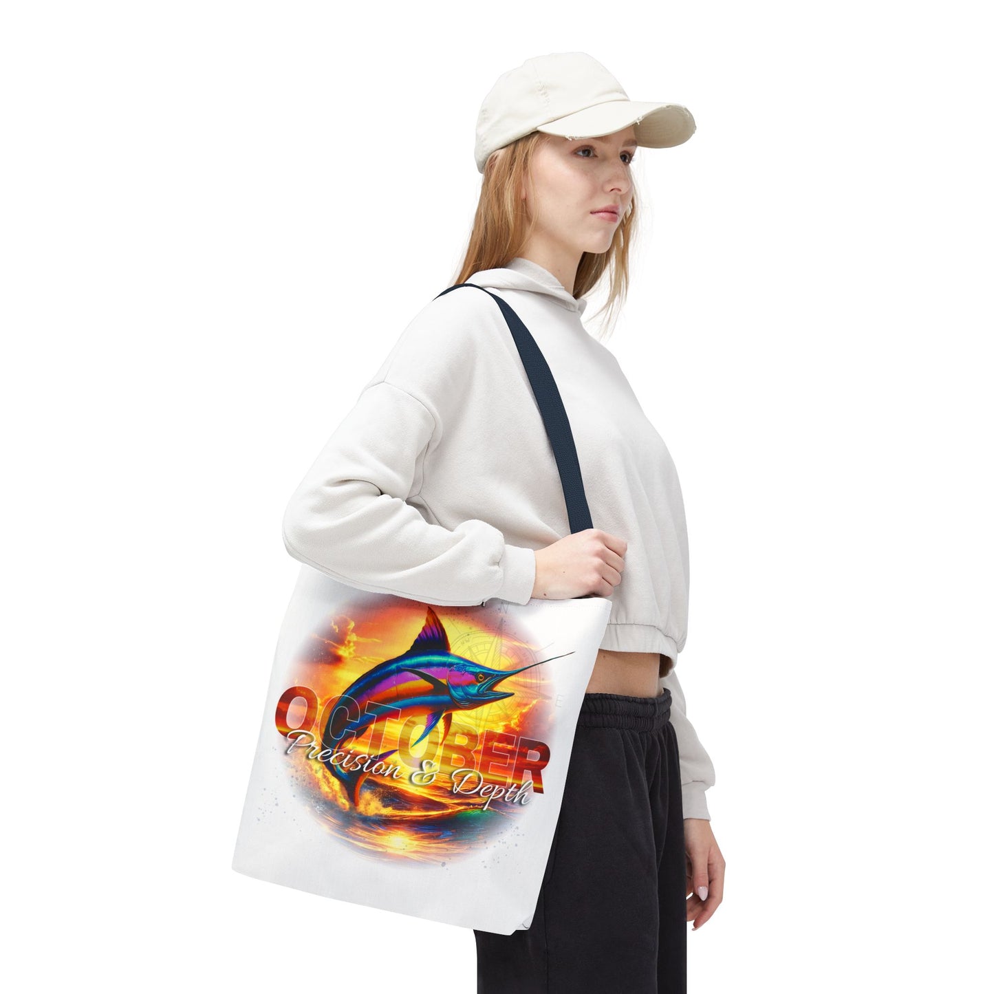 Woman wearing a white cap carrying a vibrant birth month beach tote with marlin fish design
